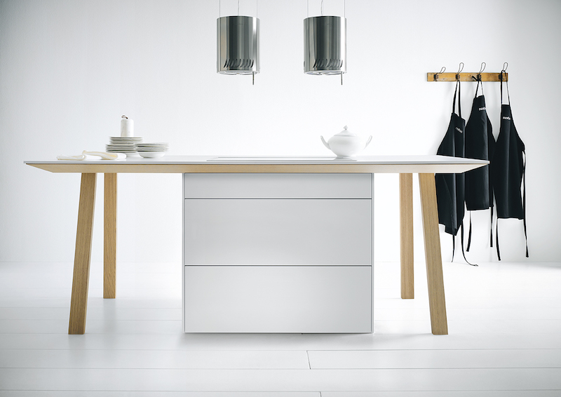 Foto Stijlvol voor de open keuken: kooktafel met werkbladafzuiging FotoStijlvol voor de open keuken: kooktafel met werkbladafzuiging